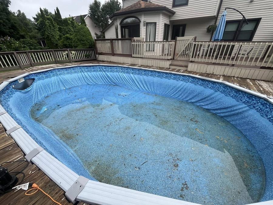 Before liner replacement in the Rochester, NY area: an old liner with a stained, faded floor