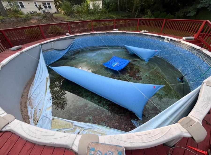 Before liner replacement in the Rochester, NY area: the old liner pulled back during the swap
