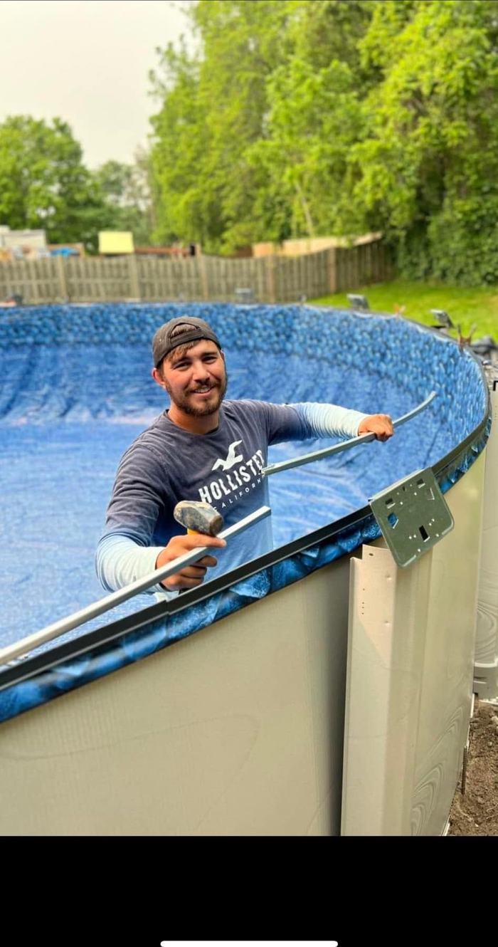 Rocco Rosso, owner of RocLiners, on the job fitting a pool liner